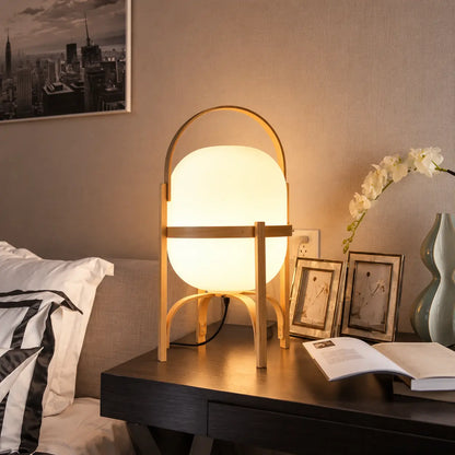 Lampe de chevet Osaka posée sur une table de nuit dans une chambre