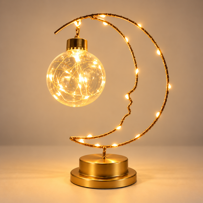 Lampe de chevet croissant de lune dorée Lumière d'Instant avec pendentif balle transparent et LED chaudes | Cocon de Lune